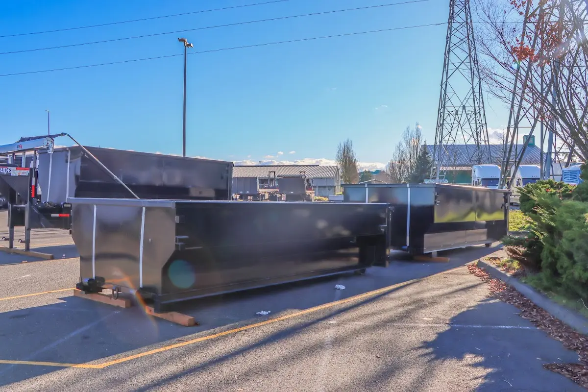 Roll-off dumpster ready for waste disposal at job site for 2 Yard Dumpster Rental in Munford